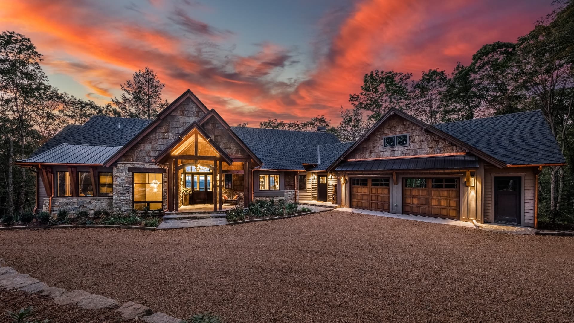 A home clad in natural poplar bark siding at dusk
