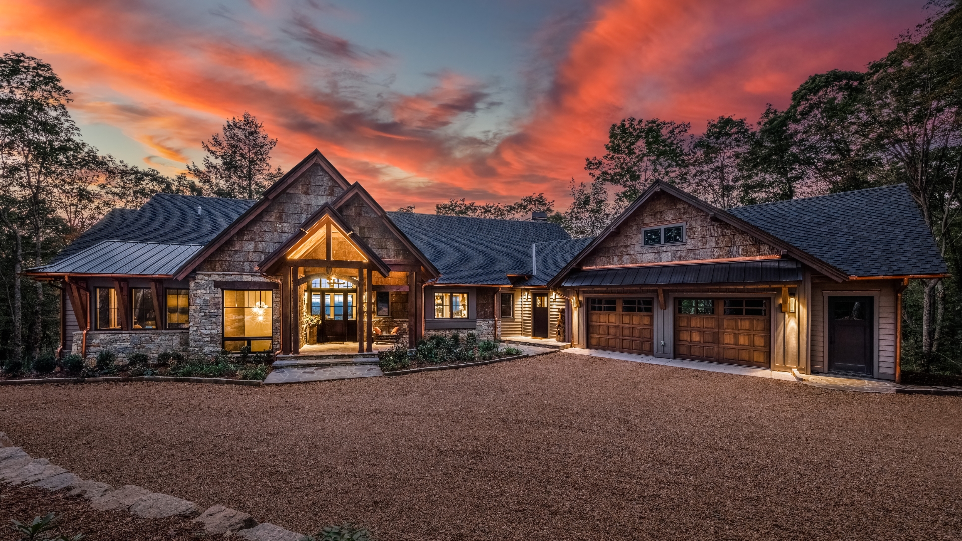 A home clad in natural poplar bark siding at dusk